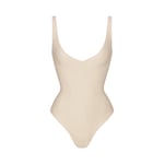 Track Stock of Skims Body Unlined Plunge Thong Bodysuit  - Sand