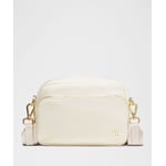 Track Stock of Lululemon Everywhere Crossbody Bag 2L - Metal Hardware - Light Ivory/Gold