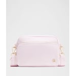 Track Stock of Lululemon Everywhere Crossbody Bag 2L - Metal Hardware - Blissful Pink/Gold