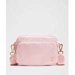 Track Stock of Lululemon Everywhere Crossbody Bag 2L - Metal Hardware - Pink Pearl/Rose Gold